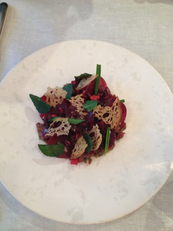Tartare of fallow deer, smoked beetroot, wild leaves, berry pearls